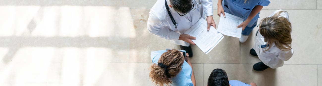 doctors-standing-in-circle-1300x350