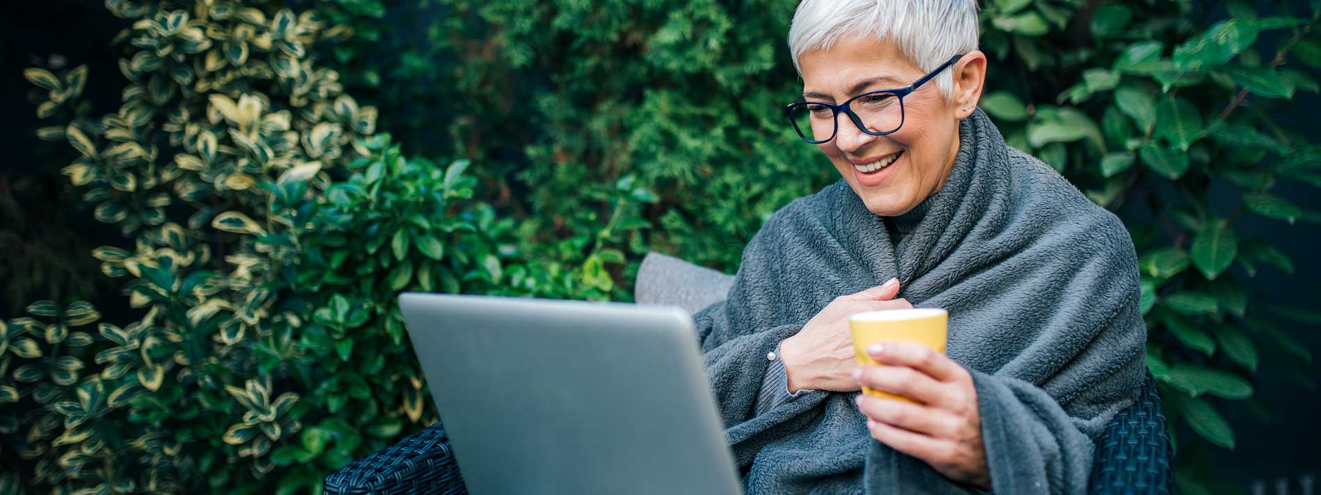 hero-sma-woman-laptop-chatting-outside-covid-coping