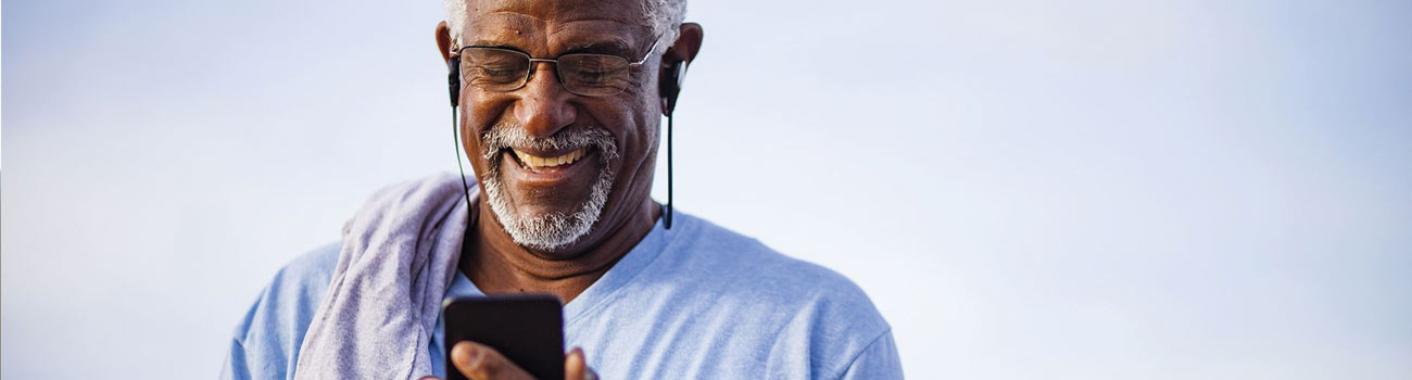 man-looking-at-phone-1300x350