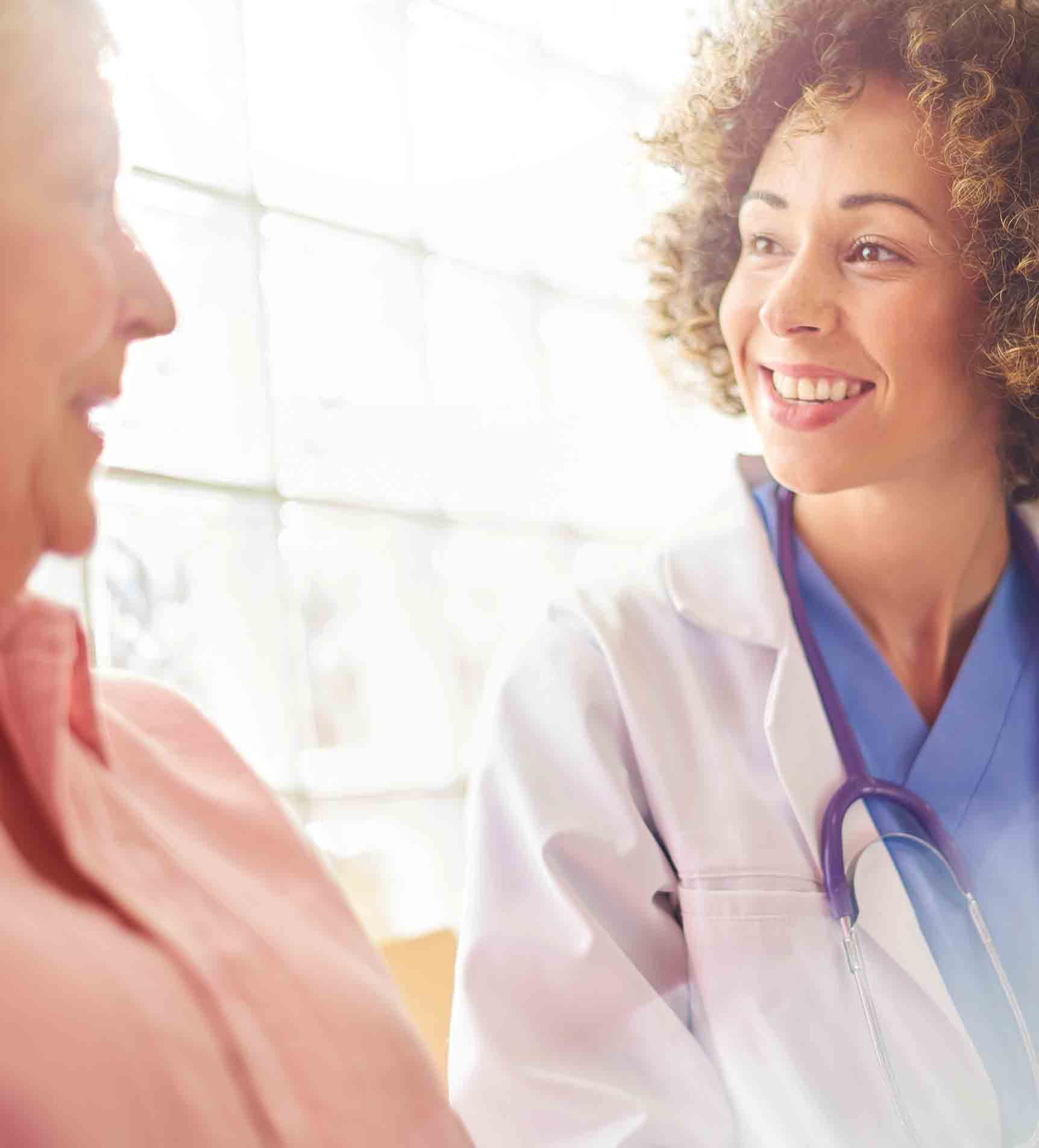 individual sitting with doctor